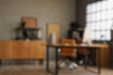 Blurred view of modern office with workplace