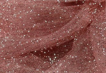 Fototapeta premium A close-up of delicate pink fabric embellished with shimmering silver glitter, creating an elegant and luxurious appearance perfect for fashion or decor.