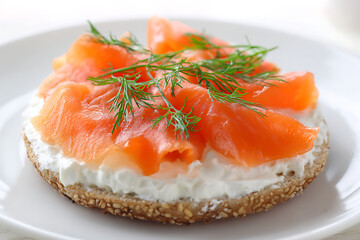 Delicious smoked salmon and cream cheese bagel topped with fresh dill