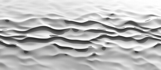 Obraz premium A serene view of smooth, flowing waves in a monochromatic white setting, creating a tranquil and minimalist atmosphere that invites reflection and calm.
