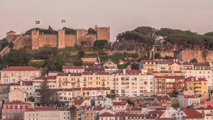 Naklejka premium Castle Castelo de Sao Jorge Belevedere aerial timelapse from Miradoura de Sao Pedro de Alcantara viewpoint. Portugal