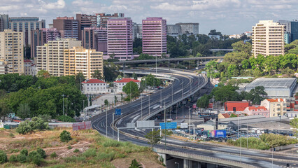 Naklejka premium High perspective view of IP7 highway elevated road with curve turn near zoo aerial timelapse. Lisbon, Portugal