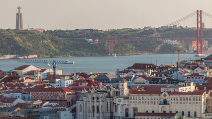 Baixa district with 25th April Bridge, Santa Justa Lift timelapse and Convento da Ordem do Carmo...