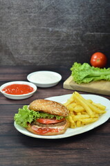 Beef burger with French fries, fresh made and tasty