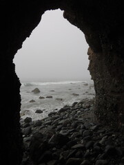 Looking out into the misty ocean from a cave.