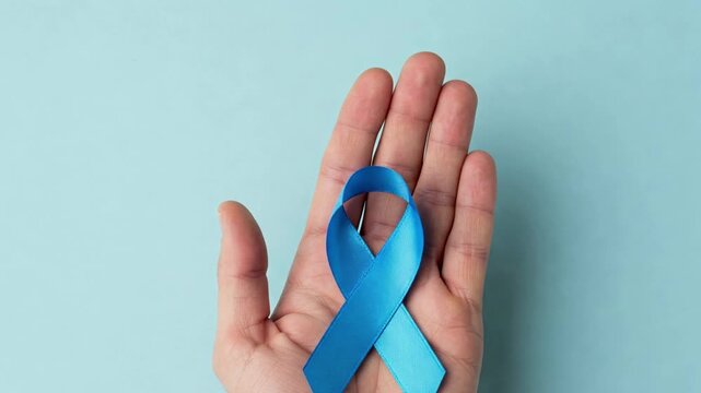 hands with blue ribbon