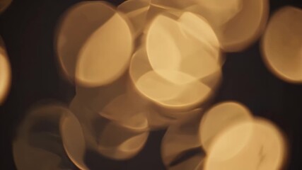 softly glowing golden orbs shimmer elegant full HD animation loop creating luxurious atmosphere warm ambient light that gently flickers beautiful seamless video background video upscale - Powered by Adobe