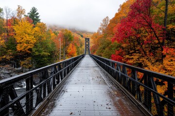 A picturesque autumn bridge surrounded by red and orange foliage,