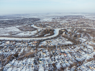 Snowy aerial panorama of Uralsk city in Kazakhstan with residential and industrial zones. c.