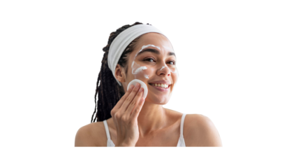 Happy Young Woman Applying Face Cream with Cotton Pad