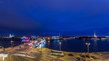 Fototapeta premium Malaya Neva river. Birzhevoy Exchange Bridge and traffic at night timelapse. St.-Petersburg, Russia