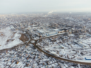 Snowy aerial panorama of Uralsk city in Kazakhstan with residential and industrial zones. c.