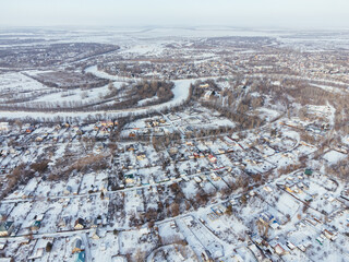 Snowy aerial panorama of Uralsk city in Kazakhstan with residential and industrial zones. c.