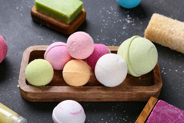 Tray with bath bombs on dark background, closeup