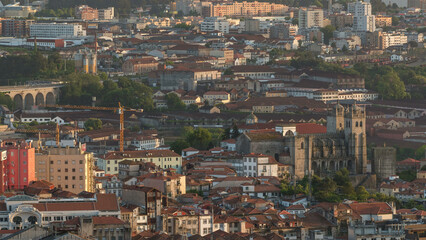 Naklejka premium Rooftops of Porto's old town on a warm spring day timelapse before sunset, Porto, Portugal