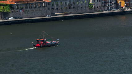 Passengers in a cruise on the Douro river in Tourist boat in Porto, Portugal timelapse