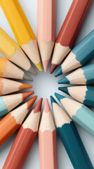 Fototapeta premium Colored pencil tips arranged in circle with warm and cool tones