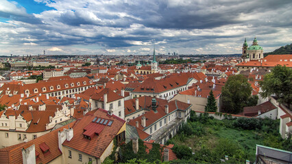 Fototapeta premium Panorama of Prague Old Town with red roofs timelapse, famous Charles bridge and Vltava river, Czech Republic.