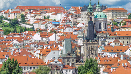 Obraz premium Charles Bridge Karluv Most and Lesser Town Tower timelapse, in the background St. Nicholas church and the castle