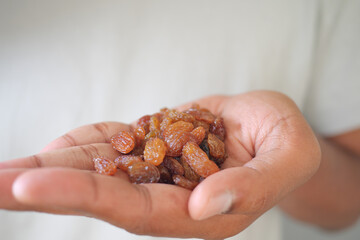 Handful of dried raisins ready for snack or baking
