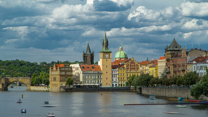 Charles Bridge and historical buildings timelapse in Prague from across the river. Prague, Czech...