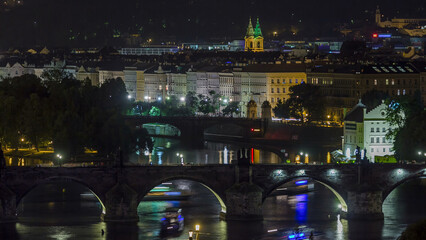 Scenic view of bridges on the Vltava river night timelapse and of the historical center of Prague: buildings