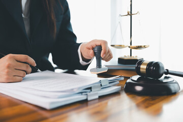 Justice and lawfirm concept. Female lawyer in office with brass scale. Woman hand gavel to bang....