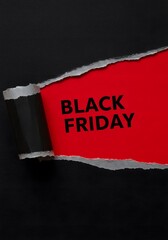 a black torn paper revealing the BLACK FRIDAY in bold black letters on a red background. Top view of Black torn paper and the text black Friday on a red background, Black Friday.