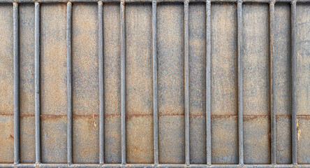 Rustic Metal Surface with Vertical Bars and Textured Background