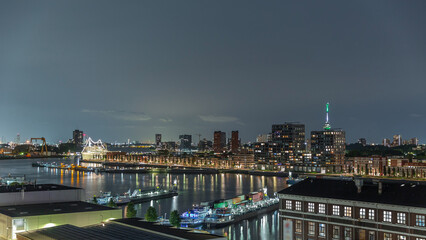 Fototapeta premium Aerial panoramic view over Maashaven night timelapse in Rotterdam.