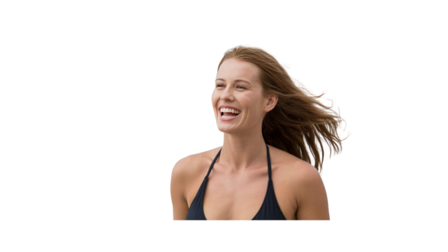 Joyful Woman with Windblown Hair Laughing on Beach Vacation