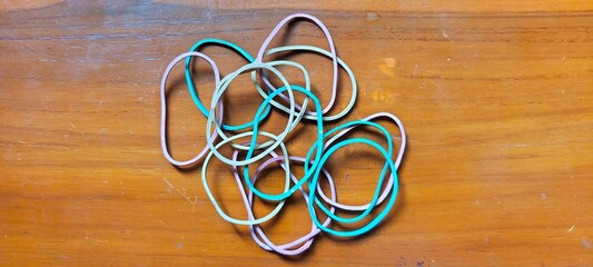 Photo of rubber bands in red, yellow, and green.
