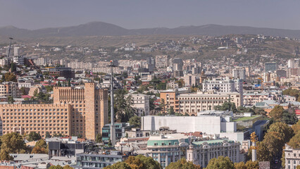Naklejka premium Aerial view of column of freedom in the center of the city timelapse in Tbilisi. Georgia