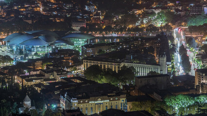 Public Service Hall seen from viewpoint in Tbilisi city illuminated at night timelapse. Georgia