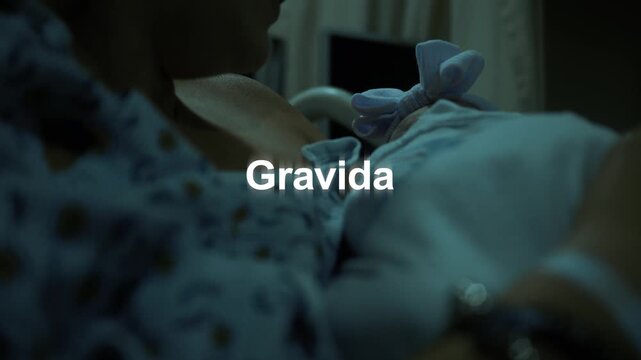 Gravida Text over Mother Holding Newborn Baby