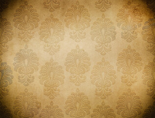 Old grunge paper texture with decorative embossed ornament.