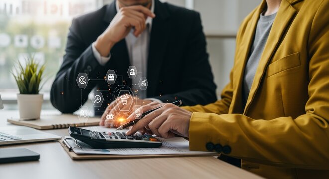 Business professionals collaborating at a desk, reviewing financial data, visualized with digital icons representing security and networking - Powered by Adobe