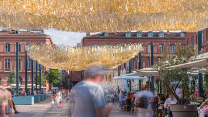 Place du Capitole timelapse in Toulouse, France. Iconic red-brick historic facades