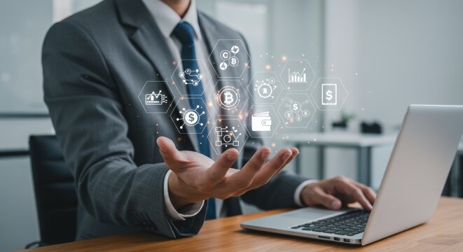 Businessman holds virtual icons over laptop