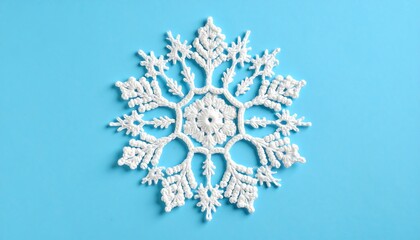 White crochet snowflake on blue