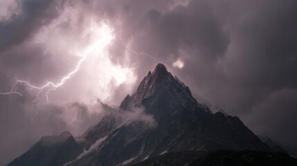 Dramatic Storm Clouds Gather Over Majestic Mountain Peak with Lightning Bolts in the Sky Creating a Striking Atmospheric Scene