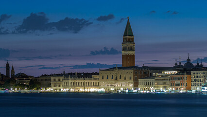 View of the Doge's Palace and the Campanile of St. Mark's Cathedral day to night timelapse. Venice,...