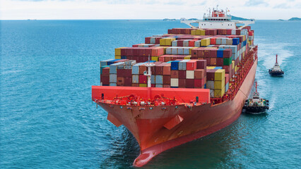 Aerial of cargo ship carrying container  for export cargo from cargo yard port to other ocean...