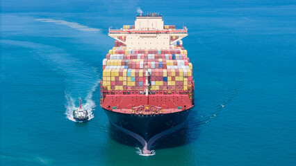 Aerial of cargo ship carrying container  for export cargo from cargo yard port to other ocean...