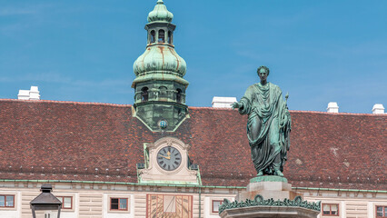 Obraz premium Statue of Kaiser Franz Joseph I timelapse at the Hofburg Palace in Vienna.