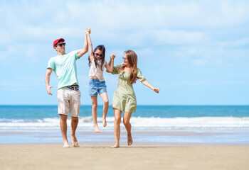 Beach Family Vacation in Summer, Happy Parents Holding Hands with Daughter and Enjoying Fun Outdoor Time Together on Sandy Seaside