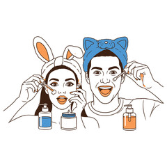 Happy young couple with cute headbands doing a skincare routine together, applying facial serum and cosmetic products for a beauty treatment.