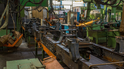 Conveyor assembly stage the body of tractor at big industrial factory timelapse