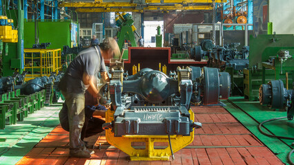 Conveyor assembly stage the body of tractor at big industrial factory timelapse