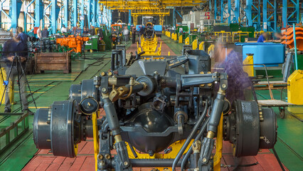 Conveyor assembly stage the body of tractor at big industrial factory timelapse